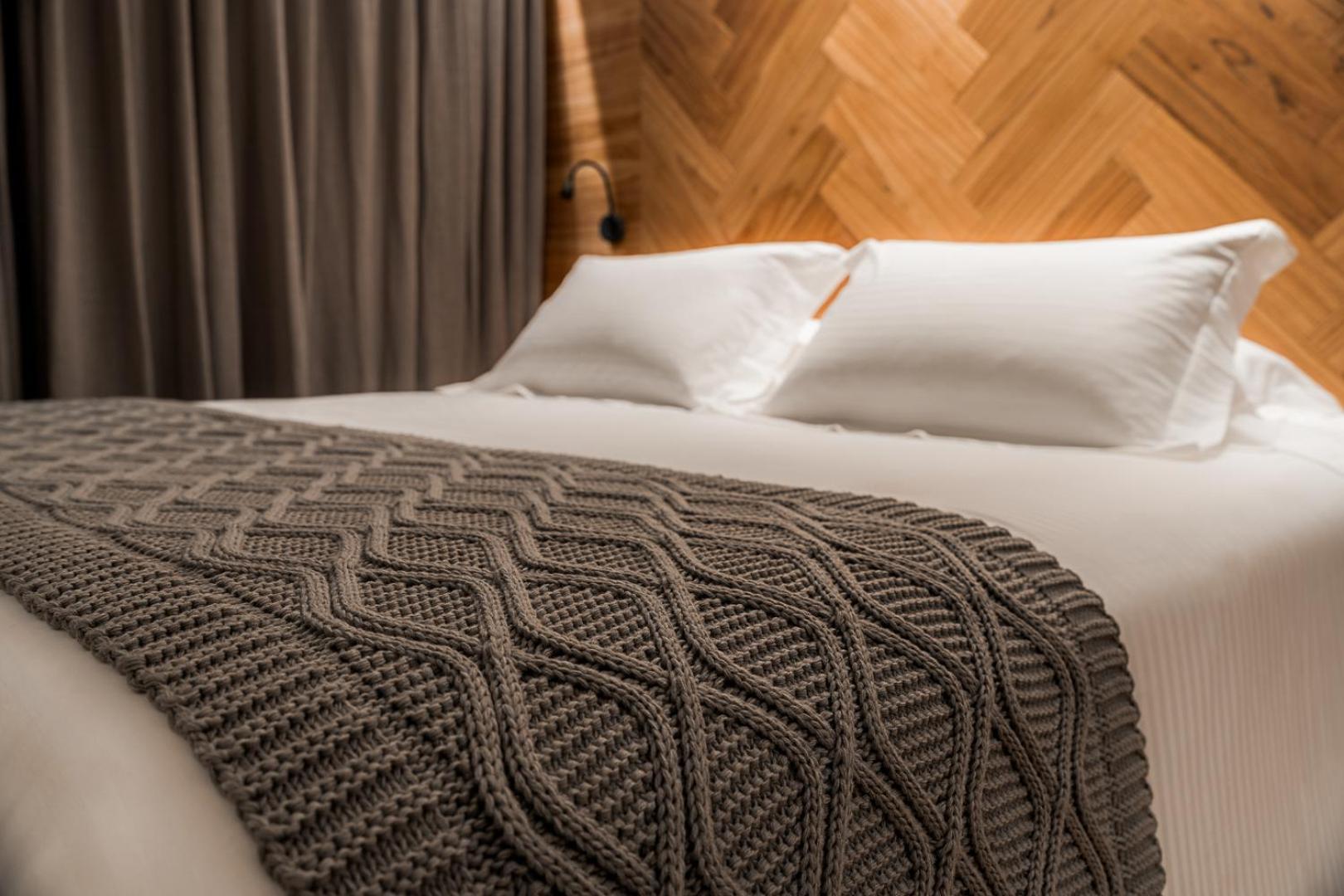 Bavaria Sport Hotel 그라마도 외부 사진 A bed with a throw